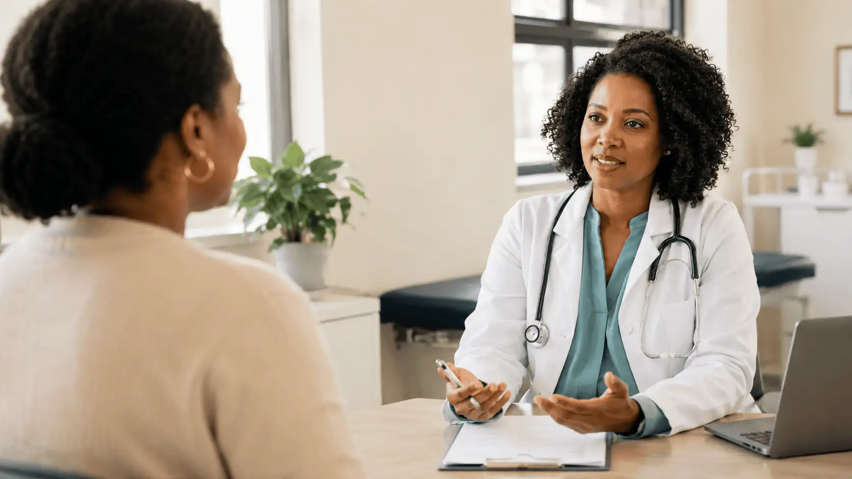 A doctor listening to a patient during a consultation